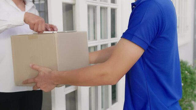 Deliveryman Carry Box Deliver To Customer In Front Of Door At Home
