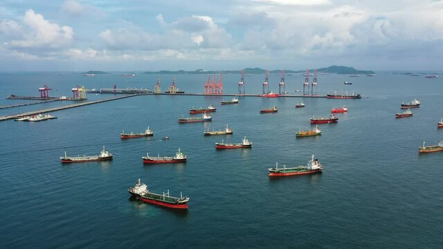 Hyperlapse. Aerial top view of the ship carrying the LPG and oil tanker in the sea port