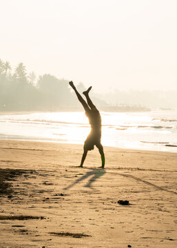 Handstand in a tropical paradise of Sri Lanka