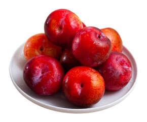 Fototapeta na wymiar Fresh red plums in plate
