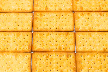 Cracker with salt isolated on white.