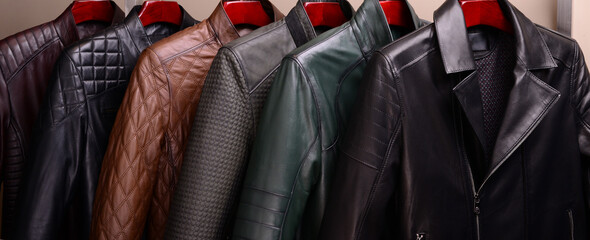 New collection of different color spring leather jackets for men. Colorful background of modern...