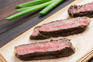 Fresh grilled meat. Grilled marbled beef steak medium rare on wooden cutting board