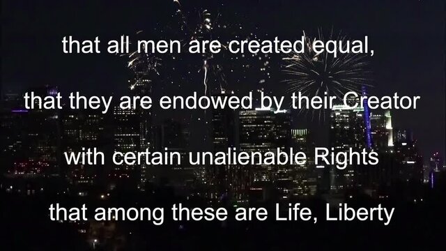 Passage from the Declaration of Independence scroll over a fireworks display in downtown Los Angeles
