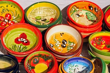 Ceramic dishes displayed outside a shop in a whitewashed village, Mijas, Spain.