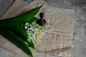 bouquet of lilies of the valley on a table with craft paper