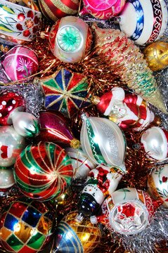 Assorted glass Christmas tree baubles and tinsel
