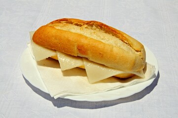 Crusty roll with Spanish Manchego cheese, Andalusia, Spain.
