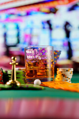 cocktail glass on the casino gambling table