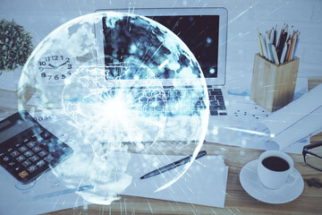 Double exposure of business theme icons and work space with computer background. Concept of success.