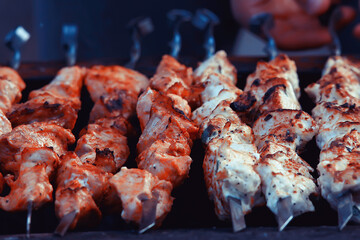 barbecue meat on coals, smoke smoked on iron skewers, fresh meat background