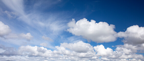 White fluffy clouds on blue sky in summer