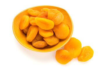 Preserved fruit. Dried sulfurized apricots in wooden bowl isolated on white background. High angle view.
