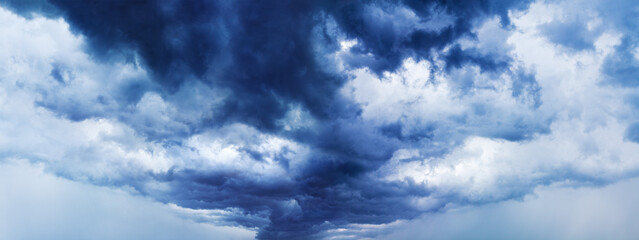 Stormy cloudy sky panorama, dramatic dark blue thunderclouds, gale clouds, thunderstorm landscape wide format, overcast weather, hurricane cloudiness skies, tornado, cloudscape, panoramic heaven view