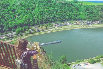 Beautiful mountain landscape with young woman enjoying wanderfull view