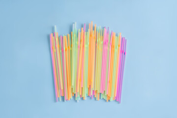  Plastic tube for drinks on a blue background.