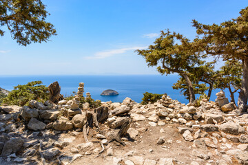 Rocky coast with wild vegetation on the west side of Rhodes island.Greece