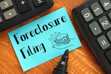 Business concept about Foreclosure Filing with sign on the piece of paper.
