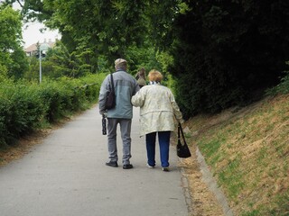Budapest, Hungary - June 01, 2020: Old couple walking on the Gellért hill in side Buda