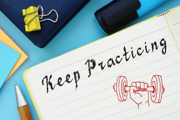 Motivation concept meaning Keep Practicing with inscription on the sheet.