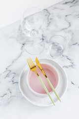 Stylish elegant table setting with ceramic plates on white marble background
