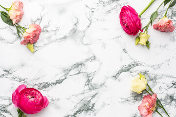 Pink and white flower bouquet on marble background with copyspace