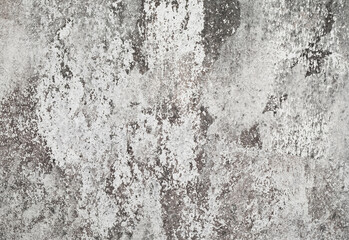 Grunge white dirty cracked concrete wall
