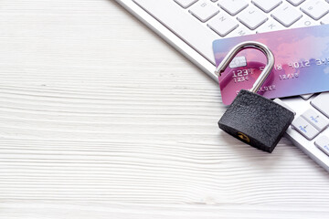 credit card hacked. keyborard, open lock on white background copy space