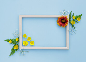 Spring, floral background. Flower arrangement. Frame with yellow-orange flowers on a light background. The concept of spring. Mother's Day, Women's Day. Flat lay, space for text. View from above.