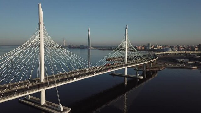 4K aerial early morning sunrise drone video of beautiful Gulf of Finland bay view of ZSD highway cable-stayed bridges in Saint-Petersburg, Russia's northern capital