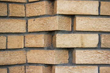 Staggered face brick wall corner