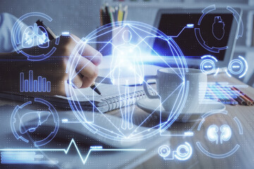 Education theme hologram over woman's hands writing background. Concept of study. Double exposure