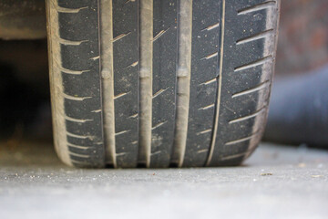 Dirty car tire close up