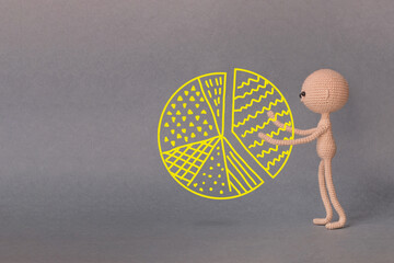 A toy man on a gray background with copy space. A sketch is drawn on top of the photo. Presentation...
