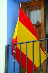 Spanish flag on balcony, Benahavis, Andalusia, Spain.