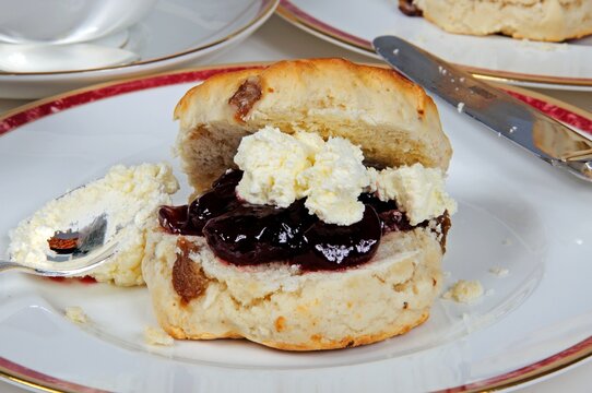 Scones with strawberry jam and clotted cream.