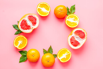 Obraz na płótnie Canvas Frame of oranges and frapefruit. Top view, copy space