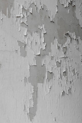 The surface of the cement wall is peeling off black and white.