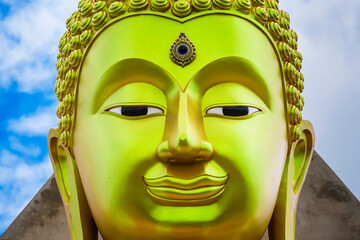 The face of Big Goldden Buddha statue of Chareon Rat Bamrung Temple (Nong Phong Nok Temple) the...