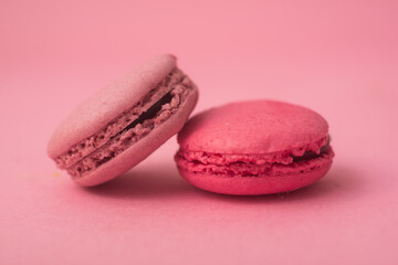 Closeup of french traditional macarons on pink background