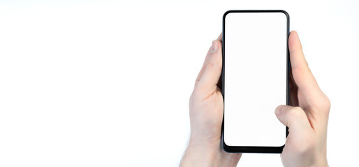 Male hand holding smartphone with blank screen on white background. Take your screen to put on advertising