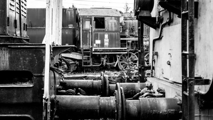 Connecting wagons with an old locomotive in the background © RITHOR