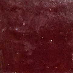 Dark red wall tile texture with uneven surface