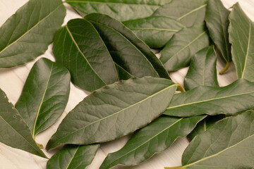 laurel leaf background on wood table. Top view. Flat lay pattern