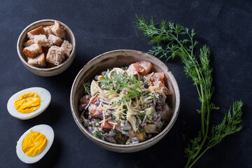 Salad with fresh vegetables  with red beans,  tomatoes,  dill, half egg,  toast Close up view
