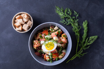 Salad with fresh vegetables  with red beans,  tomatoes,  dill, half egg,  toast Close up view