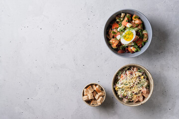 Salad with fresh vegetables  with red beans,  tomatoes,  dill, half egg,  toast Close up view