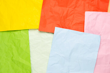 Close up of crumpled colorful empty sheets of paper.