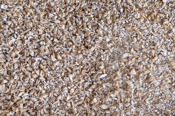 Close-up of grinded malted barley for making craft beer.