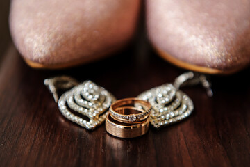 Close up wedding rings on the wood table